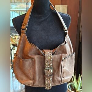 Patricia Nash Cobblestone Urbino shoulderbag. Studded strap closure, distressed